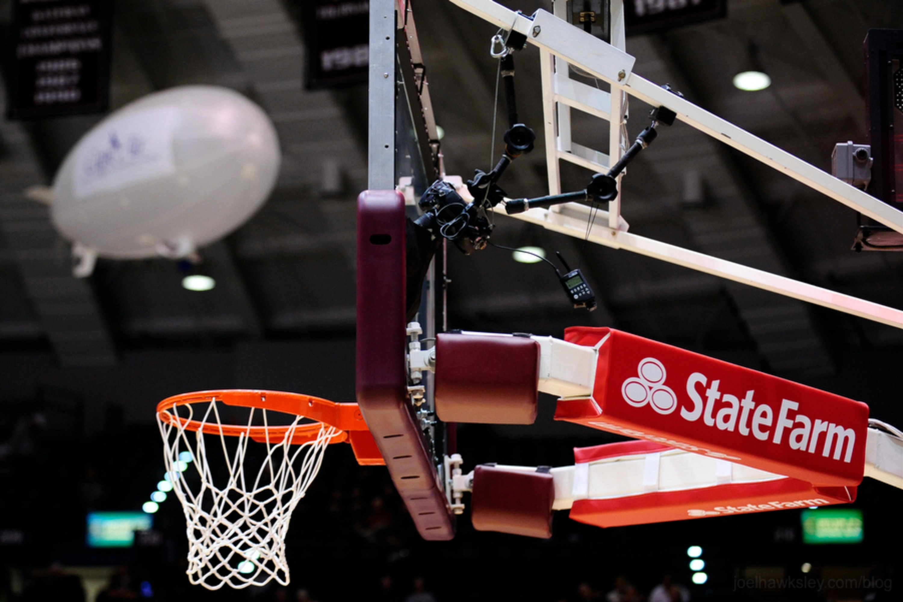 Side view of backboard remote camera mounted to basketball hoop