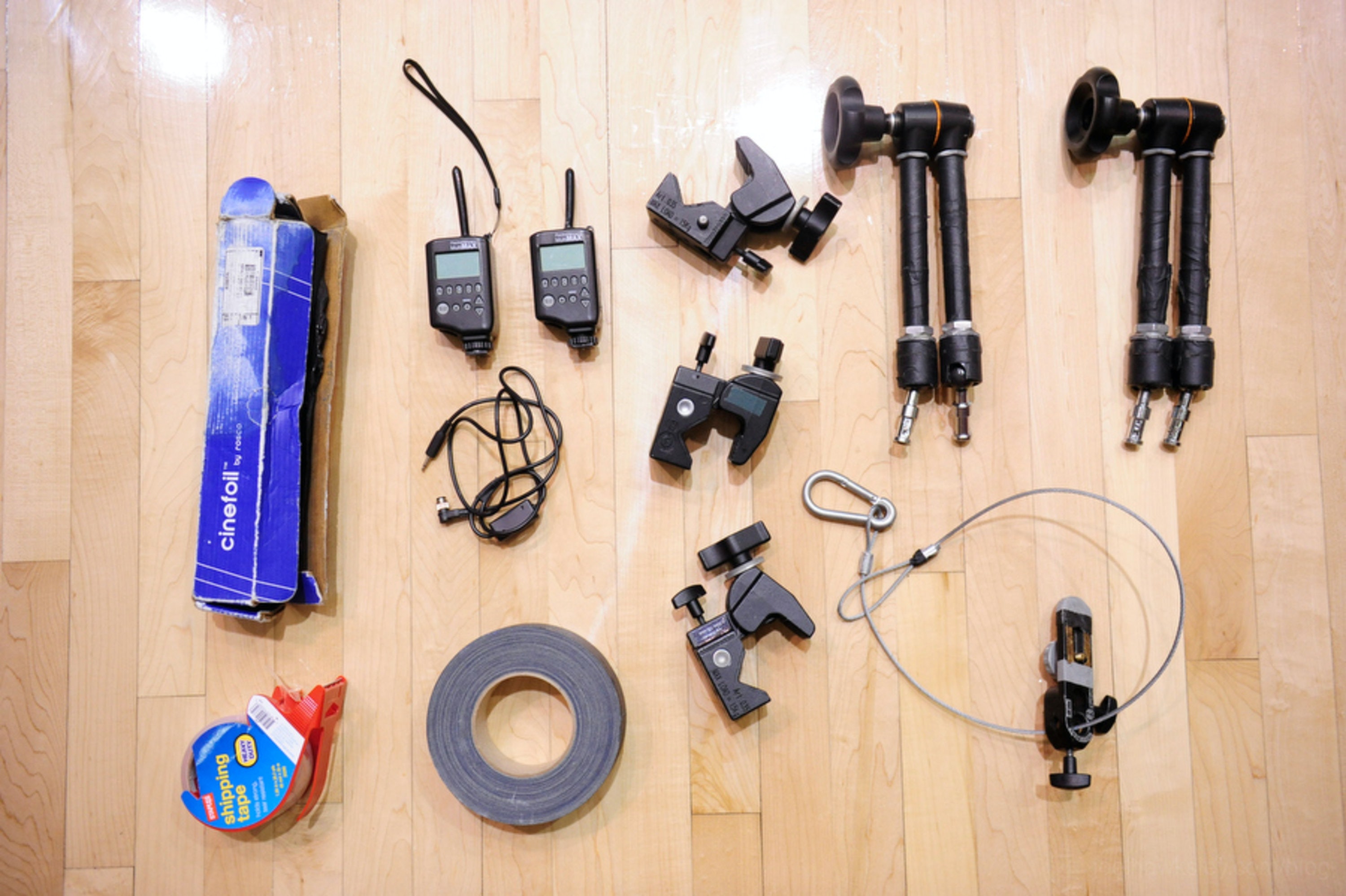 Mounting gear, radio triggers, and tape needed to rig a backboard remote camera