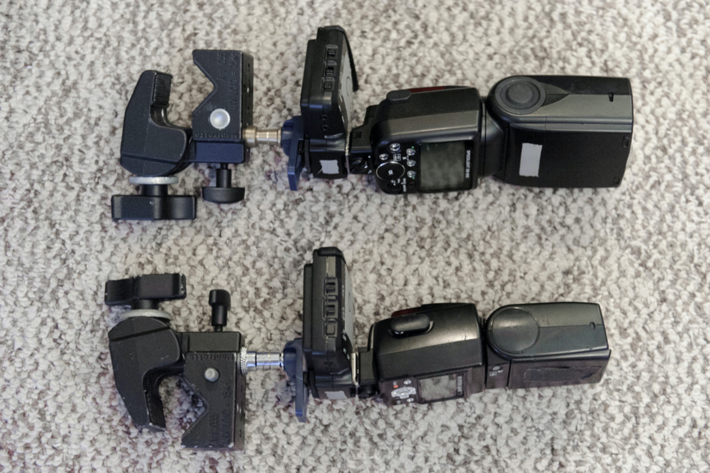 Speedlight flashes mounted to radios on super clamps